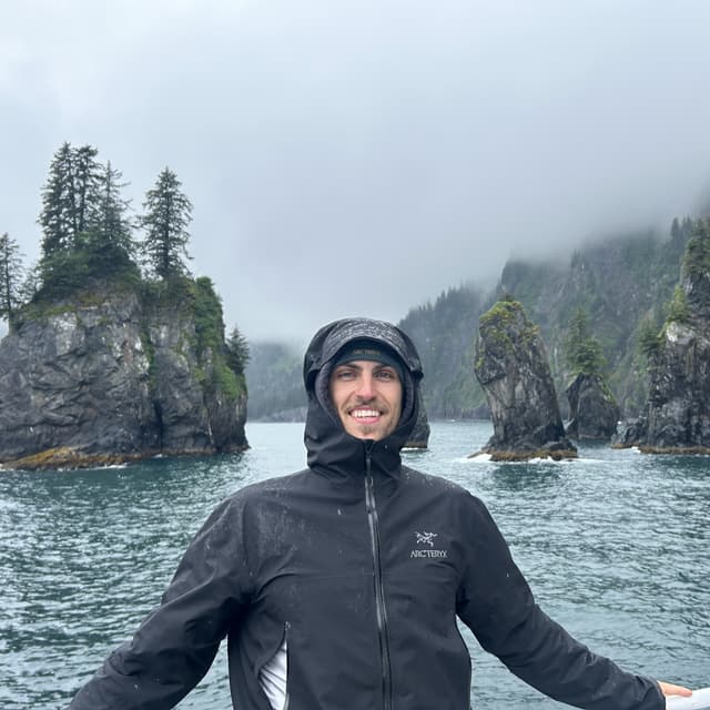 Zack in wilderness with mountain backdrop